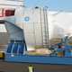 A giant GE wind turbine called the Haliade is leaving the St. Nazaire factory. The generator is located behid the hub, the pointy part up front. Photo: GE Renewable Energy